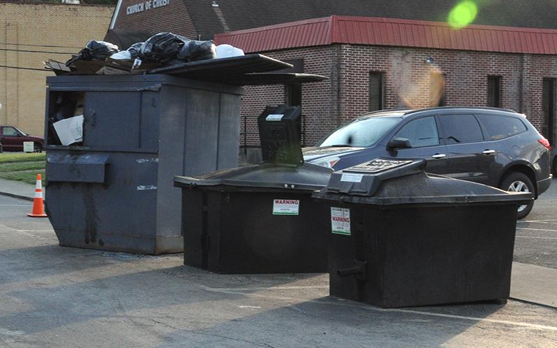 The garbage dumpster and two oil collection bins on Bridge Street will be moved to private property according to Karen Hawkins, who manages the three eateries in Riverwalk Shops.