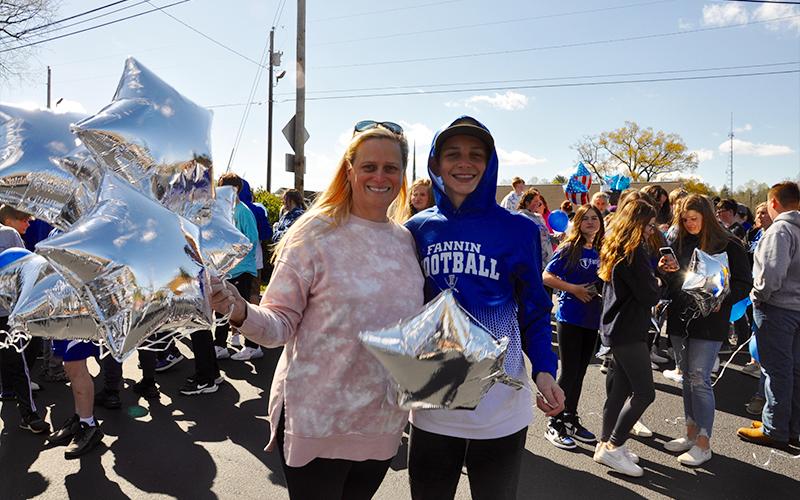 Jana Brown and Karson were two of over a hundred friends, family members and acquaintances to attend the balloon release in memory of “Dewey” Derreberry.