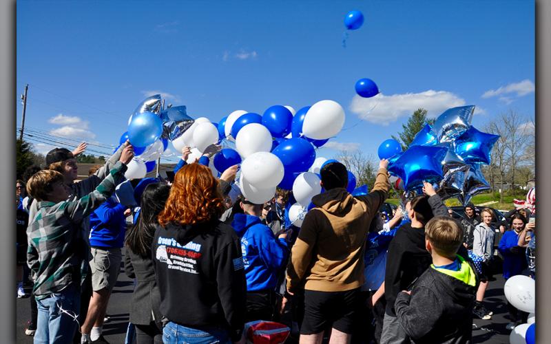 Fannin County Middle School football players released balloons before the rest of their peers in honor of fallen teammate Shane Adrian “Dewey” Derreberry Thursday, April 1.