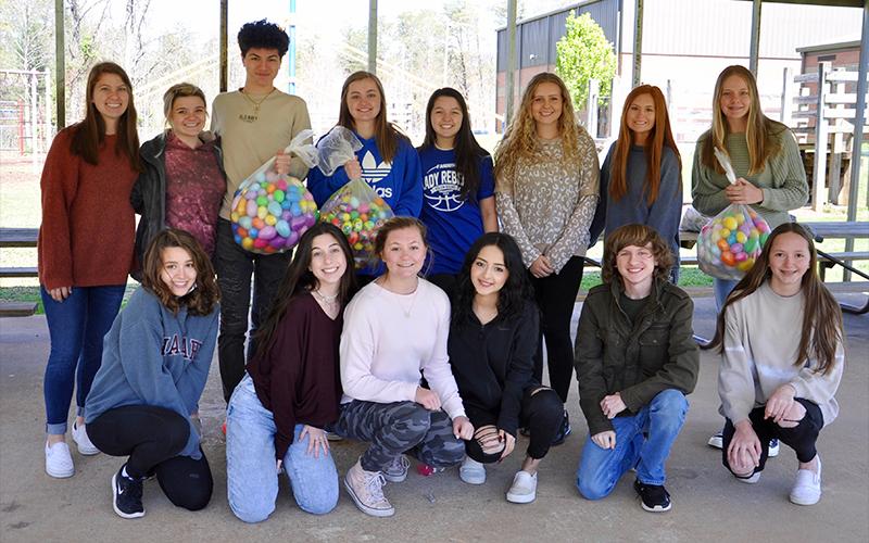 Fannin County High School Key Club orchestrated Easter egg hunts for the three elementary schools. Clubber McKenzie Chastian was credited for the idea. There to hide eggs for West Fannin Elementary students Thursday, April 1, were, from left, front, Madison Denton, Reese Lindstrom, Katherine Tamberino, Brisa Lopez, Trent Lowery and Leah Radabaugh; back, Raven Porter, Haley Ensley, Jordan Ledford, Ava Lackey, Sydney Chancey, Chastain, Olivia McAllister and Anna Beth Minear.
