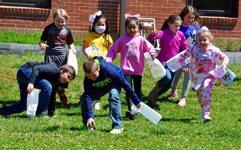 RIGHT: West Fannin Elementary School second grade students hurry from the starting line to hunt Easter eggs. Shown are, from left, front, Trent Taylor, Jack Puckett and Jaycee Hunt; back, Roger Runions, Hannah Carranza-Alvarez, Aylin Garcia, Mia Golden and Emily Cook.