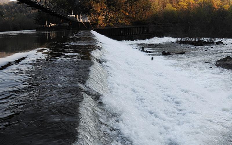 The effect of TVA's water releases from the Blue Ridge Lake dam can be seen in the Ocoee River as water flows over the wooden dam below the Ocoee #2 powerhouse.