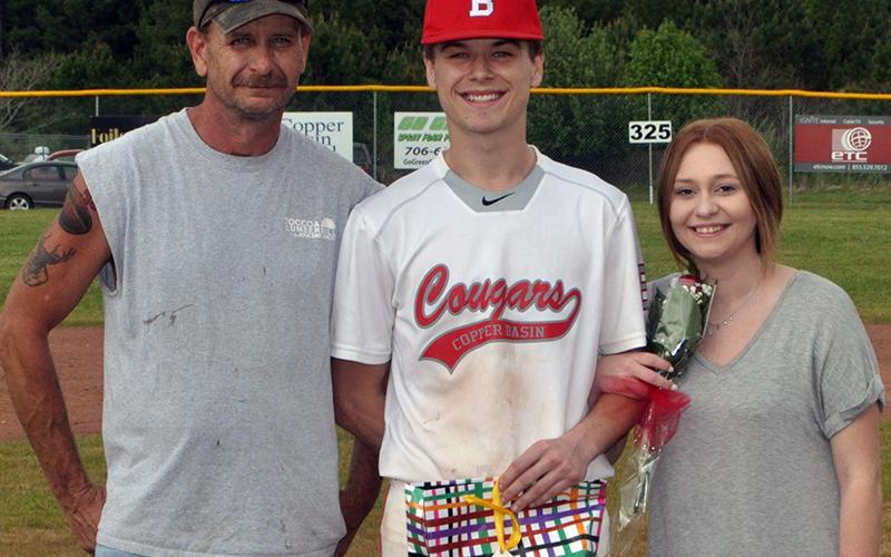 Timothy Fair was honored Thursday, April 29, at Copper Basin’s senior night ceremony before their game with Tellico Plains. Fair is shown with Scott Fair and Paige Remlinger.