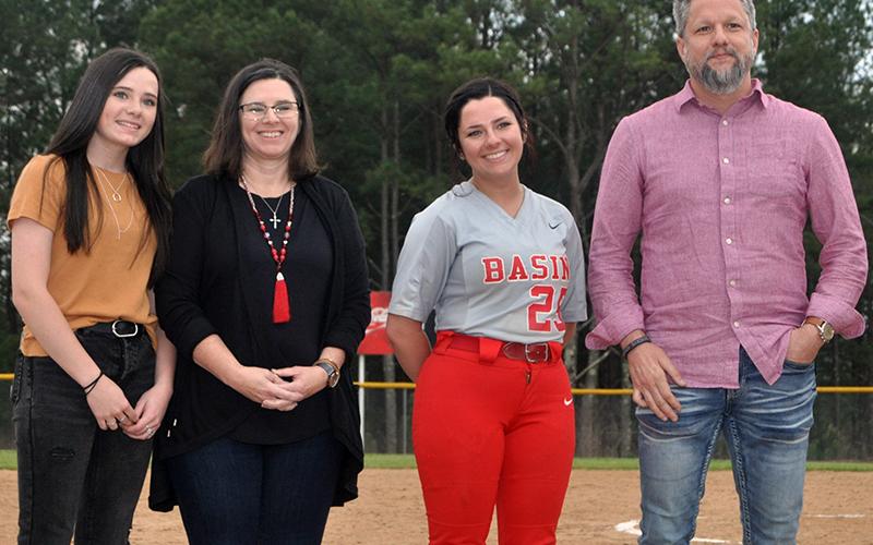 The Copper Basin Lady Cougars softball team honored their seniors Thursday, April 29, after their game against Lookout Valley. Shown during the ceremony are, from left, sister,  Emily Mundy; mother, Jenny Mundy; senior, Bailey Mundy; and father, Brian Mundy.