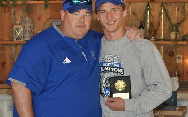 McCay Turner also received the Three-Time Threat Award for placing three years in the State Tournament during his high school career. The award was presented at the Rebels wrestling banquet Thursday, May 6. Turner is shown with Head Coach Chuck Patterson