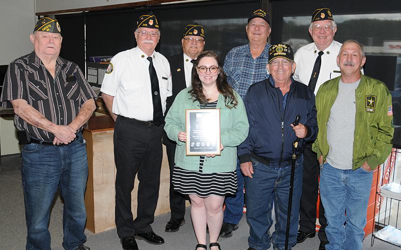 Sydney Criteser, who has been with The News Observer for almost three years, was surprised Friday by a group of local veterans who came by to say thank you on her last day with the local newspaper. They presented her with a plaque and spoke many words of appreciation. Criteser is surrounded by, from left, Gerald "Chief" McMillen, Bill Stodghill, Richard Crosley, Paul Hunter, Charles Spivey, Ron Wallace, and Sonny Payne.