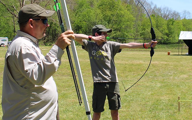 Boy Scouts of America troops from across North Georgia participated in a variety of outdoor activties when Fannin County's Troop 32 hosted their annual Highland Games Saturday, May 1, which included archery, caper tossing, hatchet tossing and stone throwing. Father and son duo, Tony and Stephen Young, of Troop 32, are shown at the archery competition station.