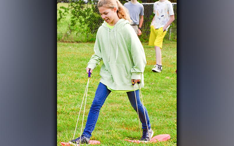 With very large feet, West Fannin Elementary School fifth-grade student Tamara Tollai races against her peers.
