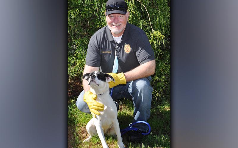 This female mix was picked up on Piney Ridge in Mineral Bluff May 11. She has a beautiful white coat with black spots. View her using intake number 146-21. She is shown with Animal Control Officer Paul Cochran.