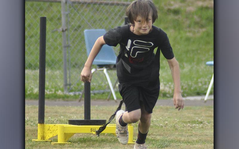 Cougar Easton Manuel completes a drill during the Cougars’ football practice Thursday, June 10.