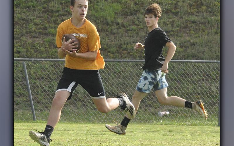 Wide receiver Carder Lance snags a pass during the Cougars’ football practice Thursday, June 10.