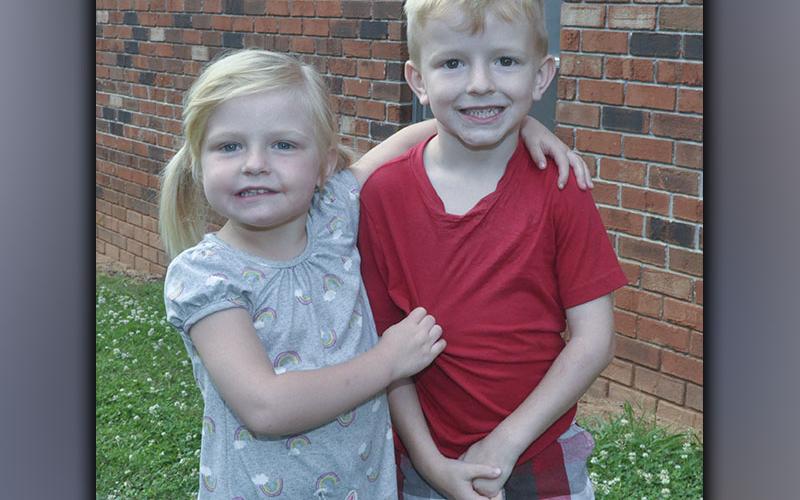 Jacquelyn and Luke Patterson are all smiles as they head to play outside during Pleasant Hill Baptist Church’s VBS Wednesday, June 9.