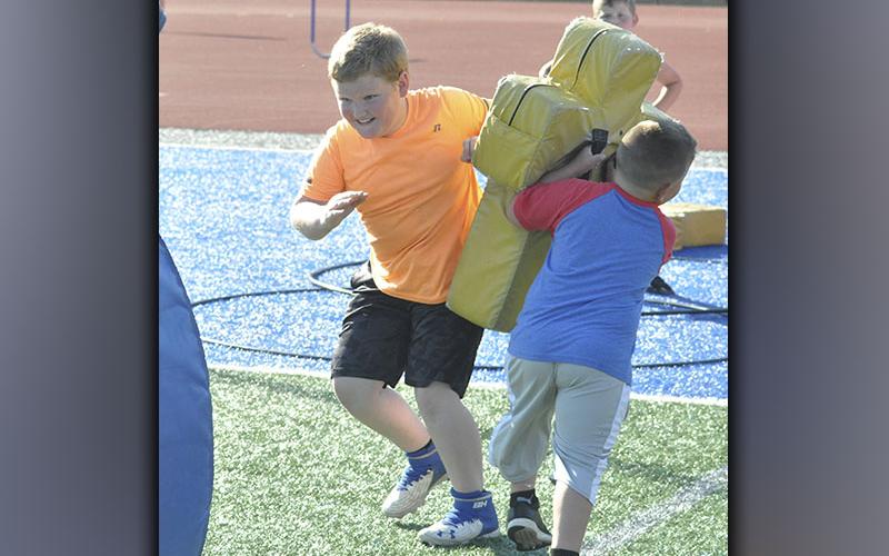 Zander Shaw sheds a tackle in a drill during football camp hosted by the Fannin County High School football team Wednesday, June 16.