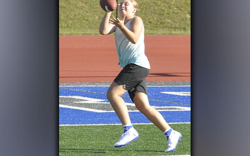 Venice Oliver hauls in a catch during football camp at the Fannin County High School football stadium Wednesday, June 16.