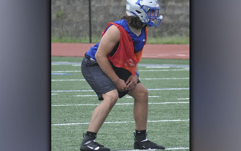 Andrew Waldrep gets lined up during the Rebels’ football practice Wednesday, June 9.