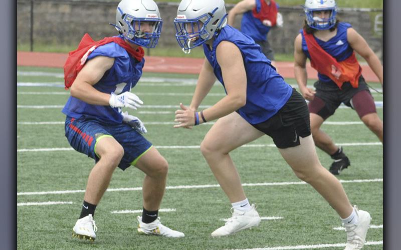 Cade Sands, left, covers Justin Pearson’s route during the Fannin Rebels’ football practice Wednesday, June 9.
