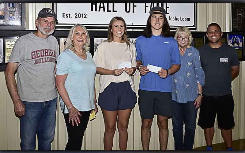 Photo by Allstar Photos The Fannin County Sports Hall of Fame recently awarded two Fannin County High School 2021 graduates with a $1,000 scholarship each. Shown during the scholarship presentation are, from left, Fannin Sports Hall of Fame members Don Clement and Sandy Acker, FCHS seniors and scholarship recipients Olivia Sisson and Luke Holloway, Sports Hall of Fame members Gilita Carter and Tim Towe.