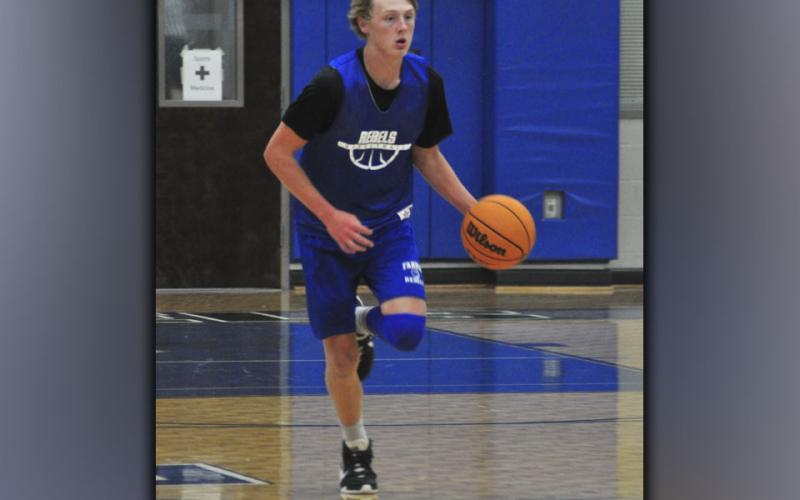 Landon Norton starts a fast break during the Fannin County High School Rebels basketball scrimmage against the Gilmer County Bobcats Wednesday, June 16.