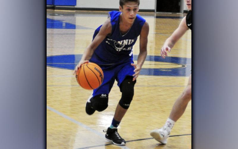 Ben Bloch drives to the basket in the first period of the Rebels basketball scrimmage against the Gilmer County Bobcats Wednesday, June 16.