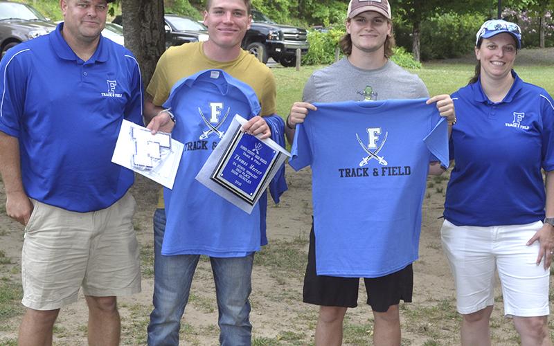 The Fannin County track and field seniors were honored during the end-of-season banquet at Horseshoe Bend Park Tuesday, May 25. Shown following the ceremony are, from left, track and field coach Shawn Ades, senior Thomas Mercer, senior James Mercer and track and field coach Hannah Godfrey. Senior Andre Bivens not pictured.