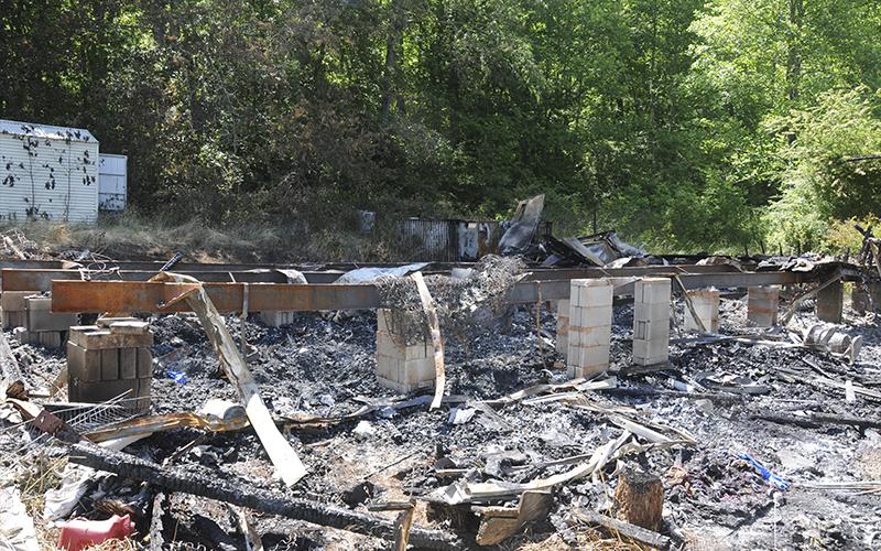 This unoccupied residence on Wolf Creek Road in Fannin County was totally destroyed by fire last Thursday night. It was one of four suspicious fires in two states.