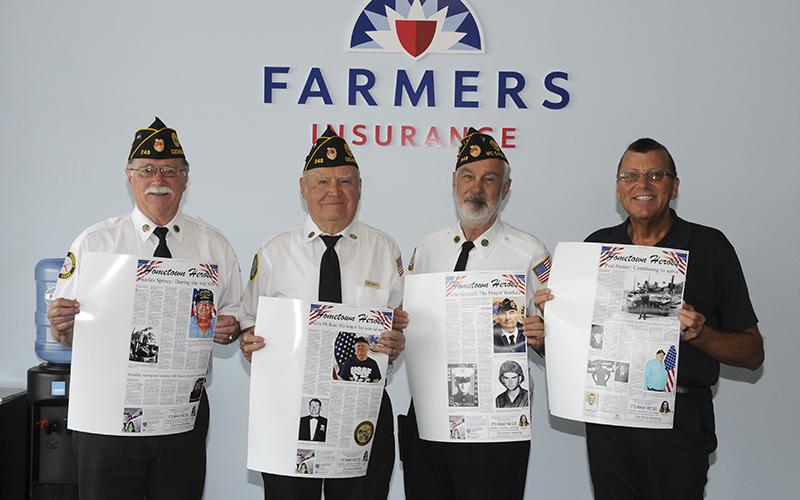 Donald Curtis, right, of Farmers Insurance in Blue Ridge recently donated photo copies of the Hometown Heroes pages from The News Observer to representatives of local veterans organizations. Each page features the story of a local veteran, and the pages are being placed in a book to remain on permanent display at the Veterans Museum near Fannin County Middle School. Shown accepting the pages are, from left, Bill Stodghill, Chris McKee, who has prepared the book, and Steve Strickland.