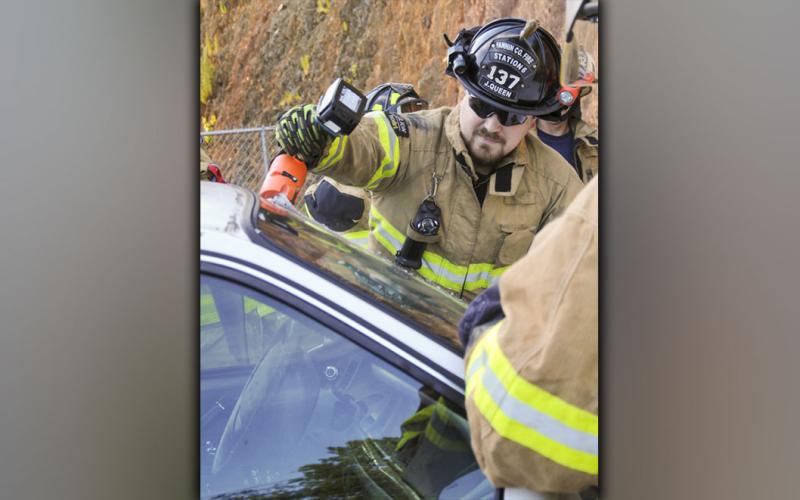 Fannin County firefighter Jacob Queen uses a specially designed rescue tool to cut through the windshield of a car. This was part of an extrication refresher course taught last week that 18 Fannin firefighters attended.