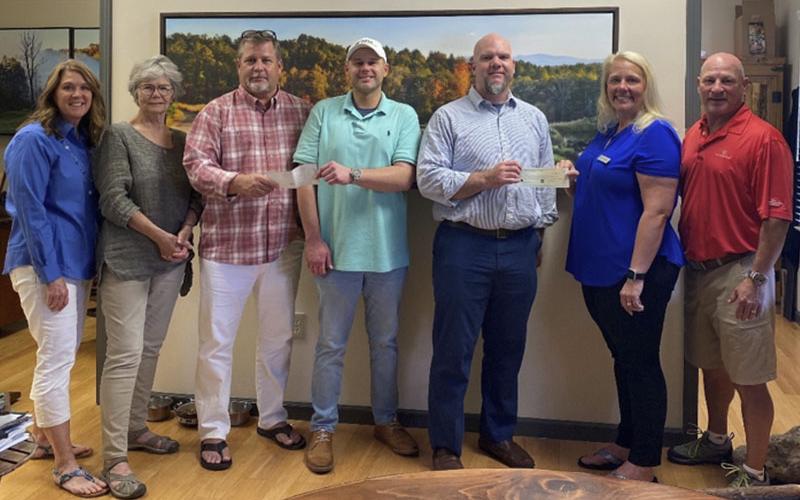 On Tuesday, May 18, Habitat for Humanity of Fannin and Gilmer Counties, along with The Open Arms Home for Children held their first annual golf tournament at Old Toccoa Farm Golf Course in Mineral Bluff. The event helped raise more than $20,000 for both charities. Shown during the check presentation are, from left, Habitat for Humanity &amp; Golf Tournament Event Coordinator Renee Lake, Habitat for Humanity President Debbie Peterson, Old Toccoa Farm Managing Partner and President Peter Knutzen, Habitat for Huma