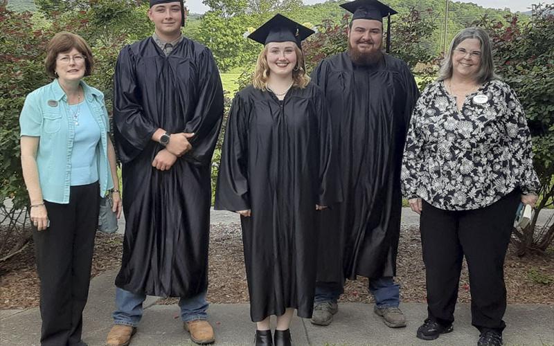 Proud GED graduates, along with a few of the people who helped them achieve their goals, celebrate together after their graduation ceremony May 18, 2021. Shown are, from left, Fannin Literacy Action Group (FLAG) Director Teresa Ross, graduates Shaun Allen, Shannon Goode and Caleb Green, and North Georgia Technical College Adult Education instructor Donna Earl.