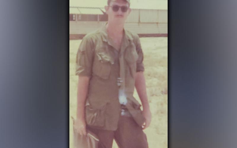 Air Force veteran Ken Campbell stops for a picture on his last day in Vietnam.