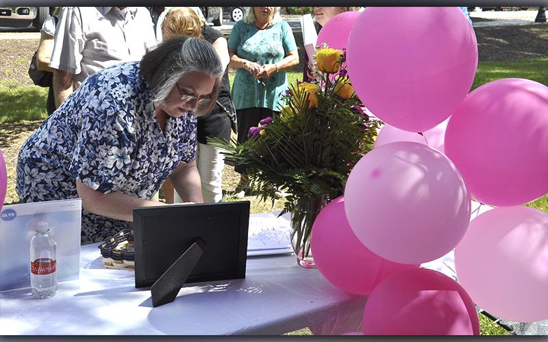 Brenda Orgo, first cousin of Glenda Herndon, signs the guest book during a Celebration of Life ceremony for Glenda Herndon in the downtown Blue Ridge Park Wednesday, May 26.