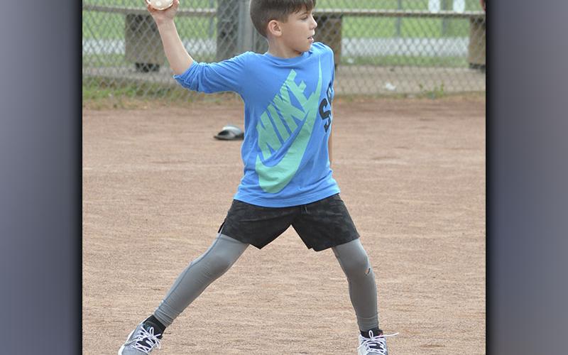 Kyle Allen tries to throw a runner out at the rec department’s Summer Camp Wednesday, June 9.