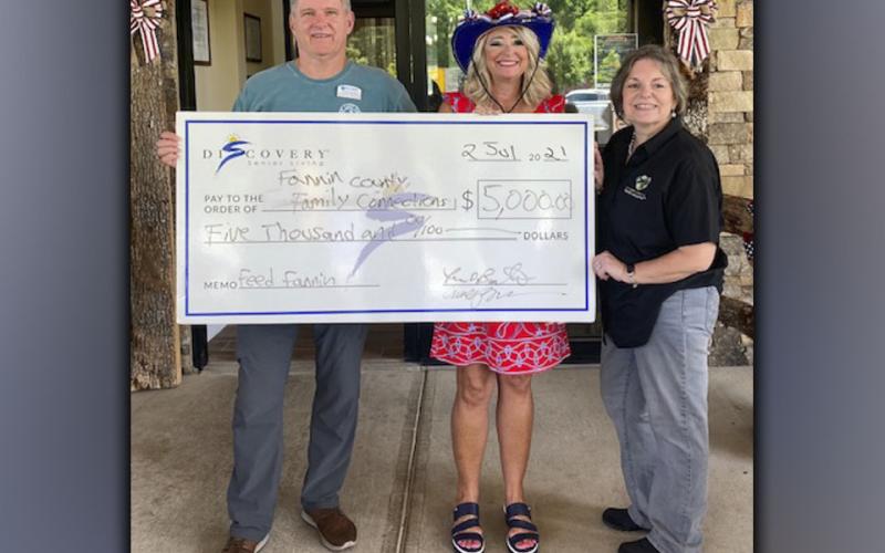 Blue Ridge Assisted Living and Memory Care Executive Director Faron Barton and Senior Lifestyles Counselor Cindy Querry, from left, presented Family Connection Executive Director Sherry Morris with $5,000 for Feed Fannin.