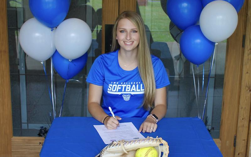 Allie Ballew smiles as she recently signed a scholarship to further her academic and athletic career playing softball at Tennessee Wesleyan University.