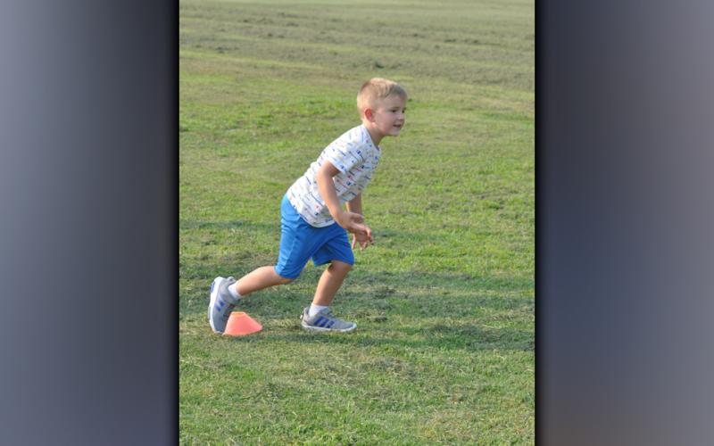 Josey Payne learns what foot to lead off with during Copper Basin’s youth football camp Thursday, July 22.