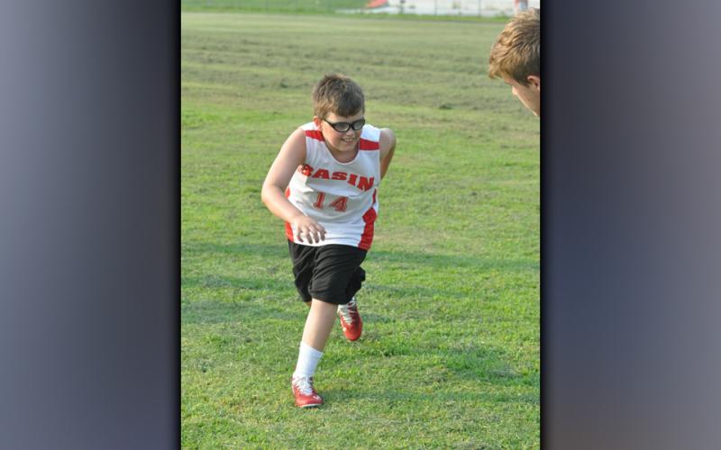 Edward Cole chases down the ball during Copper Basin’s youth football camp Thursday, July 22.