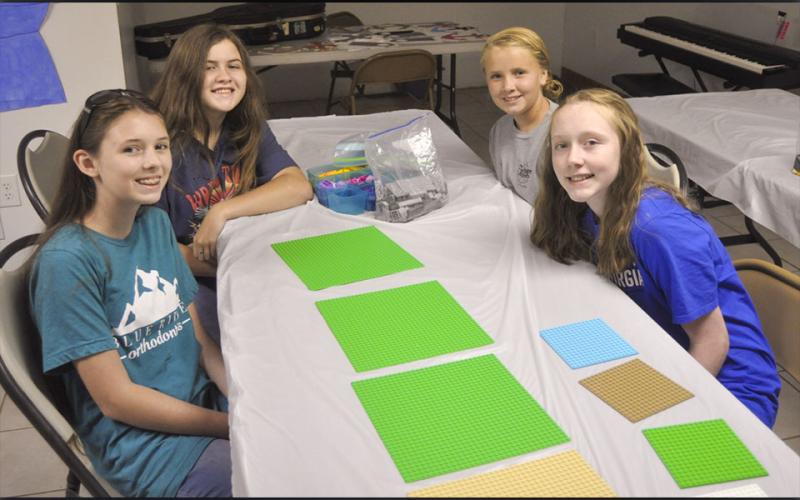 The middle-school-aged group spent a portion of their time building with legos during the McCaysville Gospel Tabernacle’s Vacation Bible School Tuesday, July 13. Shown are, from left, Emily Dickey, Natalie Reeves, Kenslee McClure and Emma Buchanan.