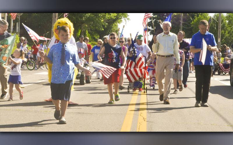 Ducktown Mayor for the day Izaiah Bradburn, left, leads the Patriotic Walking Parade to kick off the festivities Saturday, June 26, at the 46th Annual Miner’s Homecoming.