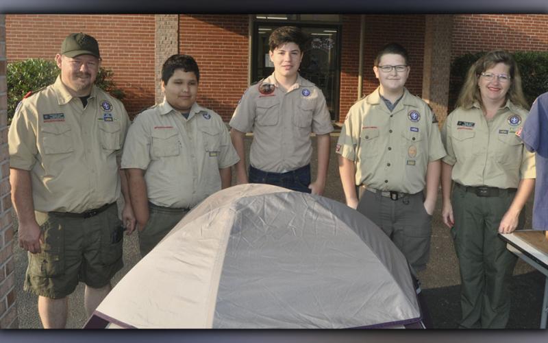 Scout Troop 32 and Cub Pack 432 were all smiles as they assisted in the Epworth Community Club Pancake Breakfast Saturday, July 3. Shown are, from left, Assistant Scout Master Raymond Green, Jordan Kinman, Chase Roll, Roy Green and Pack 432 Community Chairman Glenda Green.