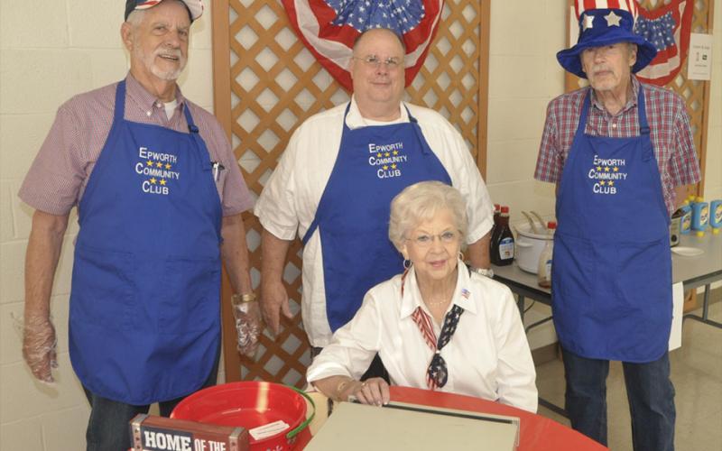 There were plenty of volunteers at  the Epworth Community Club Pancake Breakfast Saturday, July 3. Some of the volunteers shown are, from left, front, Margaret Mason; and back, Nick Wimberly, Bryon Ahrens and Sid Buggs.