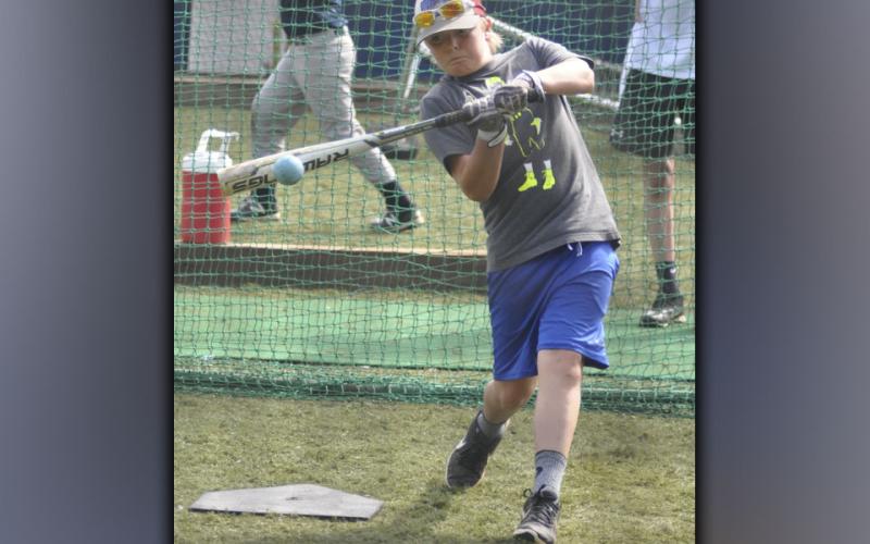 Cauy Sutton makes contact with a ball during Fannin County High School baseball’s hitting camp Wednesday, July 14.
