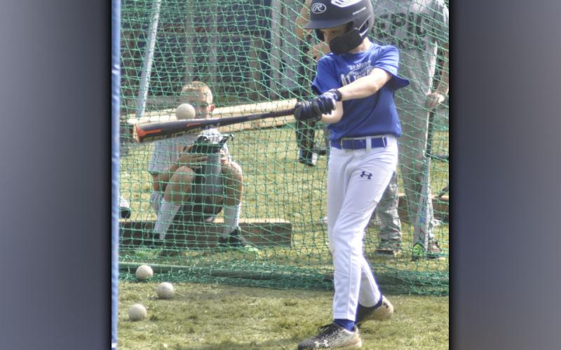 Aiden Owensby works on his batting technique during hitting camp hosted by the Fannin County High School baseball team.