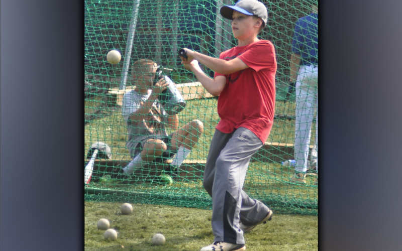 Ethan Owensby crushes a ball during hitting camp at the Fannin County High School batting cages Wednesday, July 14.