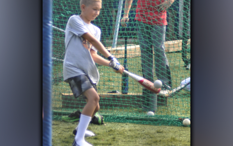 Noah Oliver makes contact with the ball during hitting camp that was hosted by the Fannin County High School baseball team Wednesday, July 14.