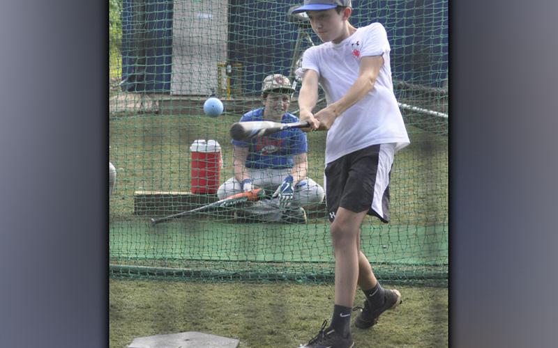 Heath Bradburn connects on a pitch during Fannin County High School baseball’s hitting camp Wednesday, July 14.