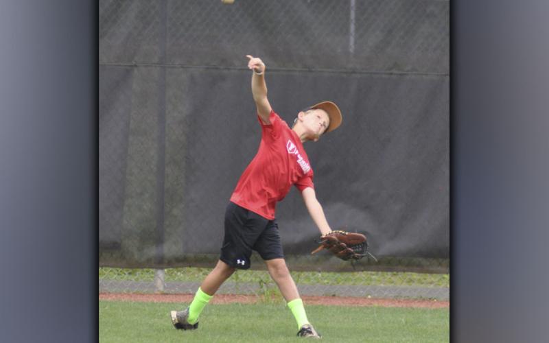 Parker Borns gets the ball to his throwing partner during the Pitchers and Catchers Camp Wednesday, July 7.