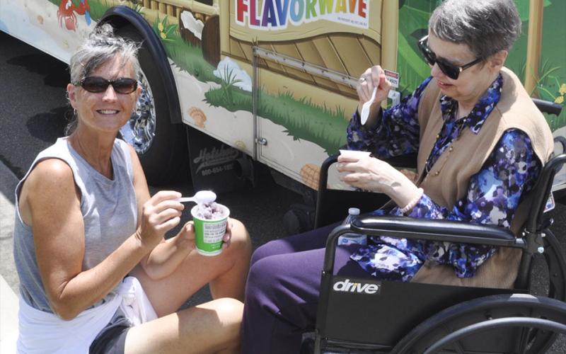 Shown enjoying some cold tasty treats during the festivities at Blue Ridge Assisted Living and Memory Care are Denise Eilers, left, and Pamela Ward.