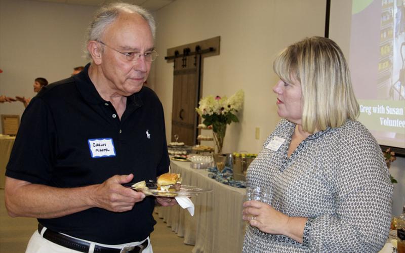 Carlos Martel and Sandy Ott enjoy conversation over hors d’oeuvres during Fannin County Chamber of Commerce’s Business After Hours at Fannin County Family Connection.