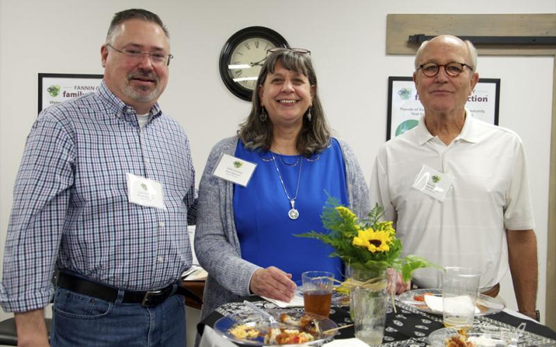 Fannin County Family Connection Board of Directors members Michael Kilpatrick, Anna Speessen and Gordon Riddoch, from left, smile for a photo during Fannin County Chamber of Commerce’s Business After Hours.