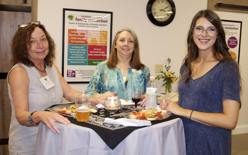 Fannin County Family Connection Board of Directors member Renee Lunney, Family Connection Administrative Assistant Mandy Hyde and family connection intern Jacqueline McKee take it easy at Fannin County Chamber of Commerce’s Business After Hours Thursday, July 22.